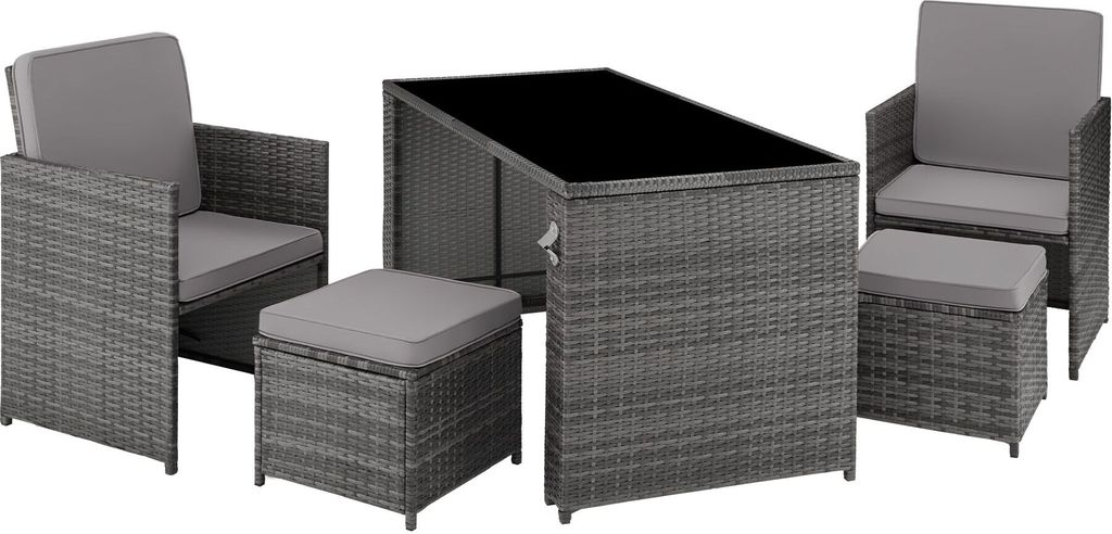 A rattan furniture set with a table, two chairs, and two ottomans, displayed on a white background.