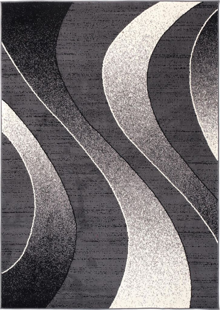 A close-up, top-down view of a modern rug with abstract wavy patterns in shades of gray, black, and white.