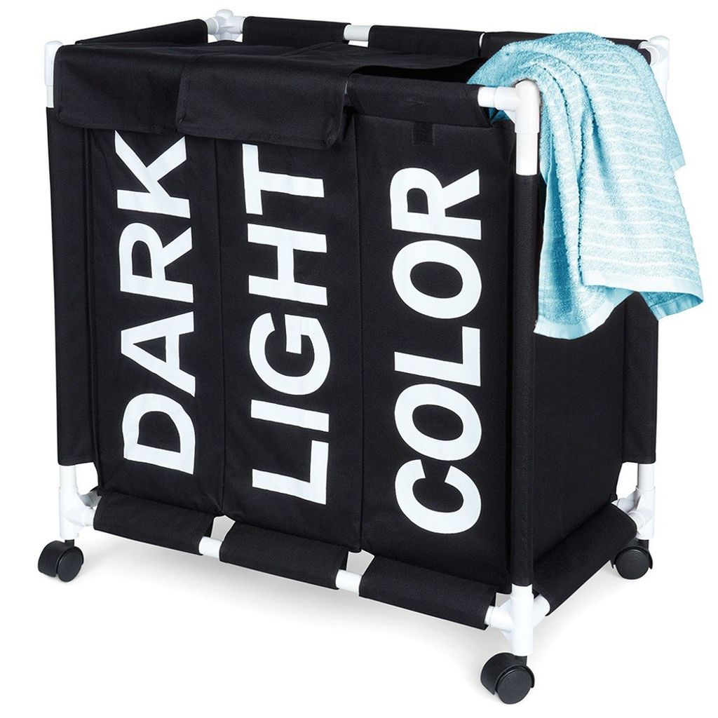 A black laundry basket with three compartments labeled 'DARK', 'LIGHT', and 'COLOR'. It has a white frame and wheels, and a blue towel is draped over the top right corner.