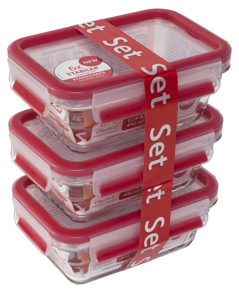 A stack of three glass food storage containers with red lids, held together by a red band with white text.