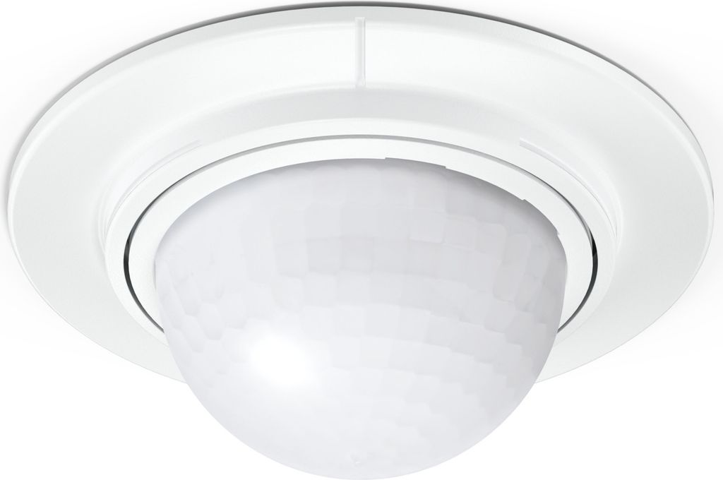 A white ceiling-mounted motion sensor.