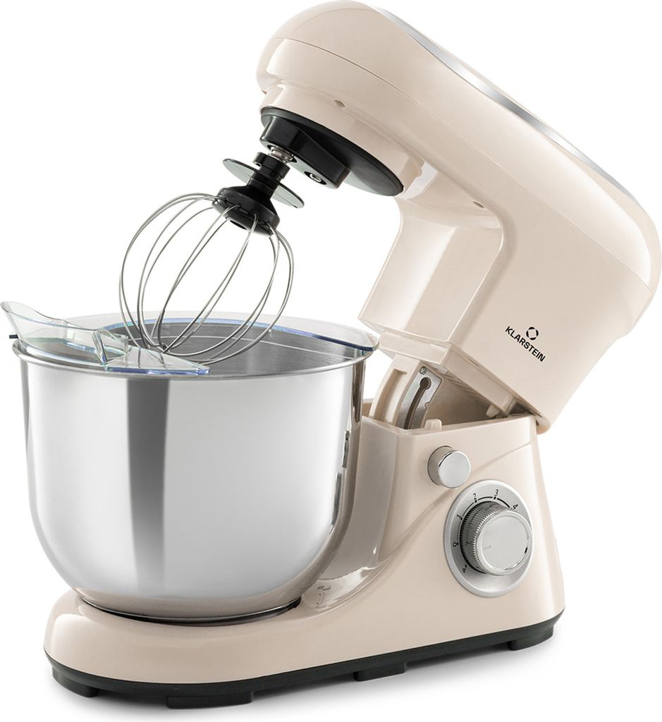 A cream-colored stand mixer with a silver bowl and whisk attachment is shown against a white background.