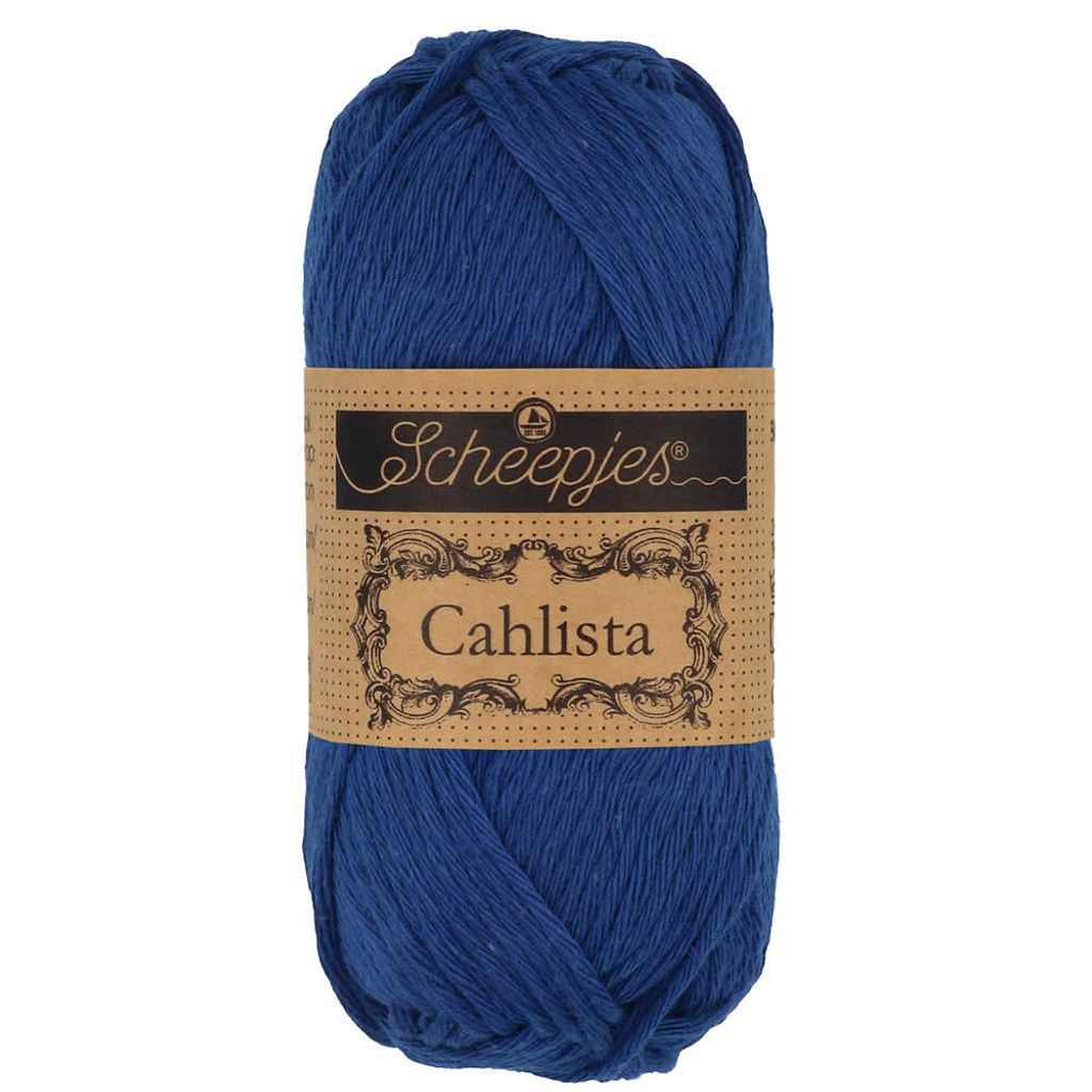 A ball of blue yarn with a brown label.