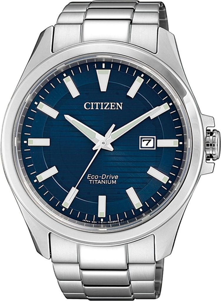 A close-up studio shot of a Citizen Eco-Drive Titanium watch with a blue dial and a silver metal band.