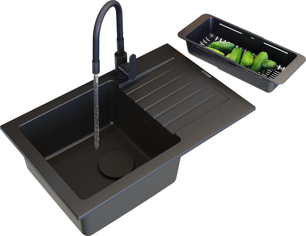 A black kitchen sink with a faucet running water into it, and a colander with cucumbers next to it.