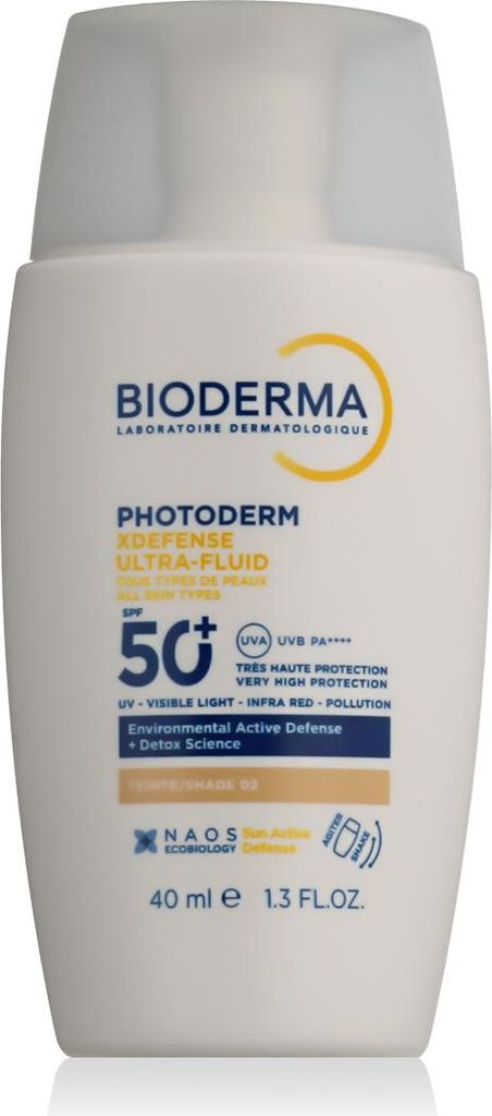 A white bottle of Bioderma sunscreen with text and logos on it.