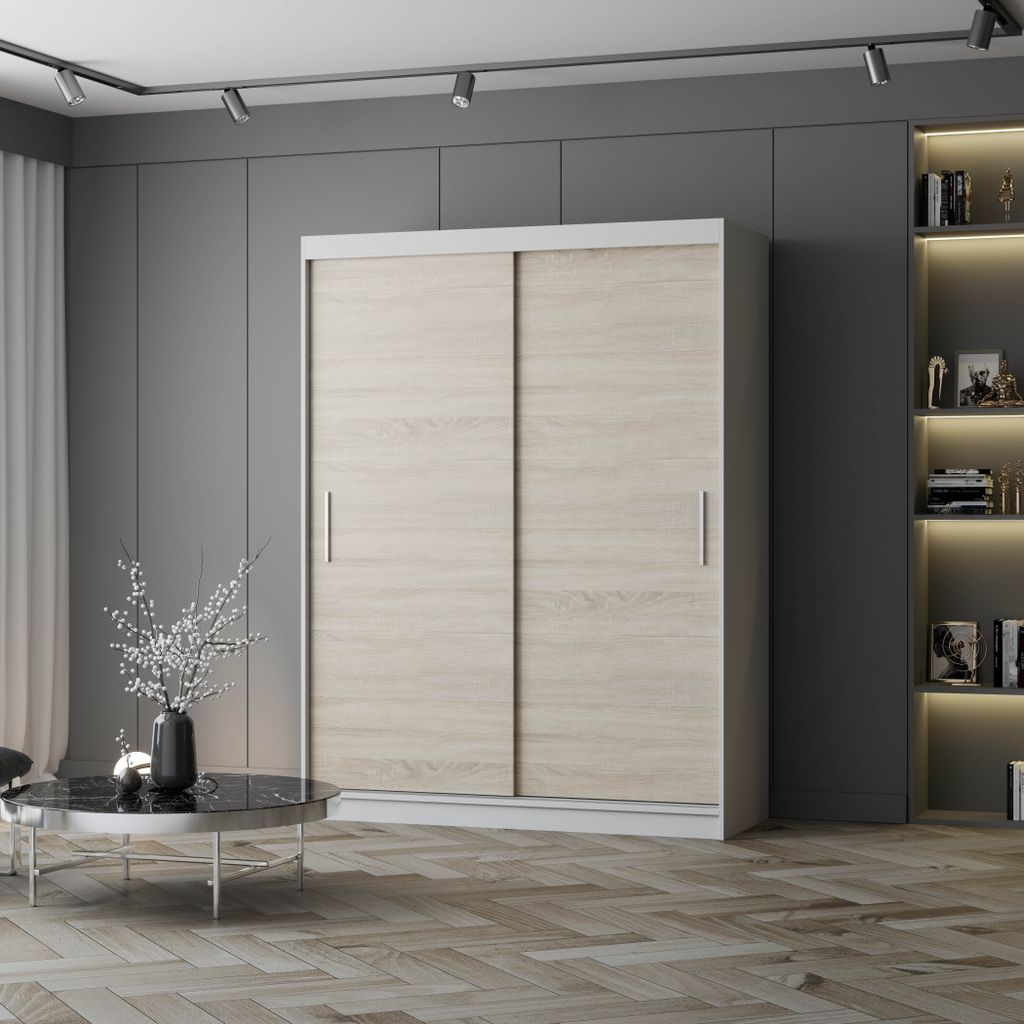 A modern bedroom with a large sliding door wardrobe, a coffee table with a vase of flowers, and a bookshelf.