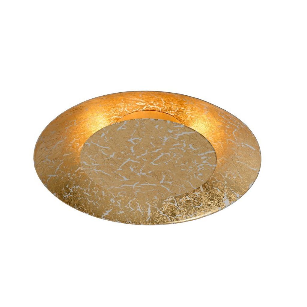 A close-up, top-down view of a decorative golden plate with a textured white pattern.