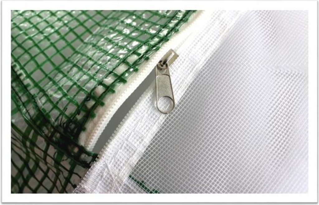 A close-up view of a zipper on a greenhouse cover.