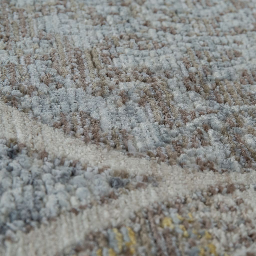 A close-up view of a textured rug with a vintage floral pattern.