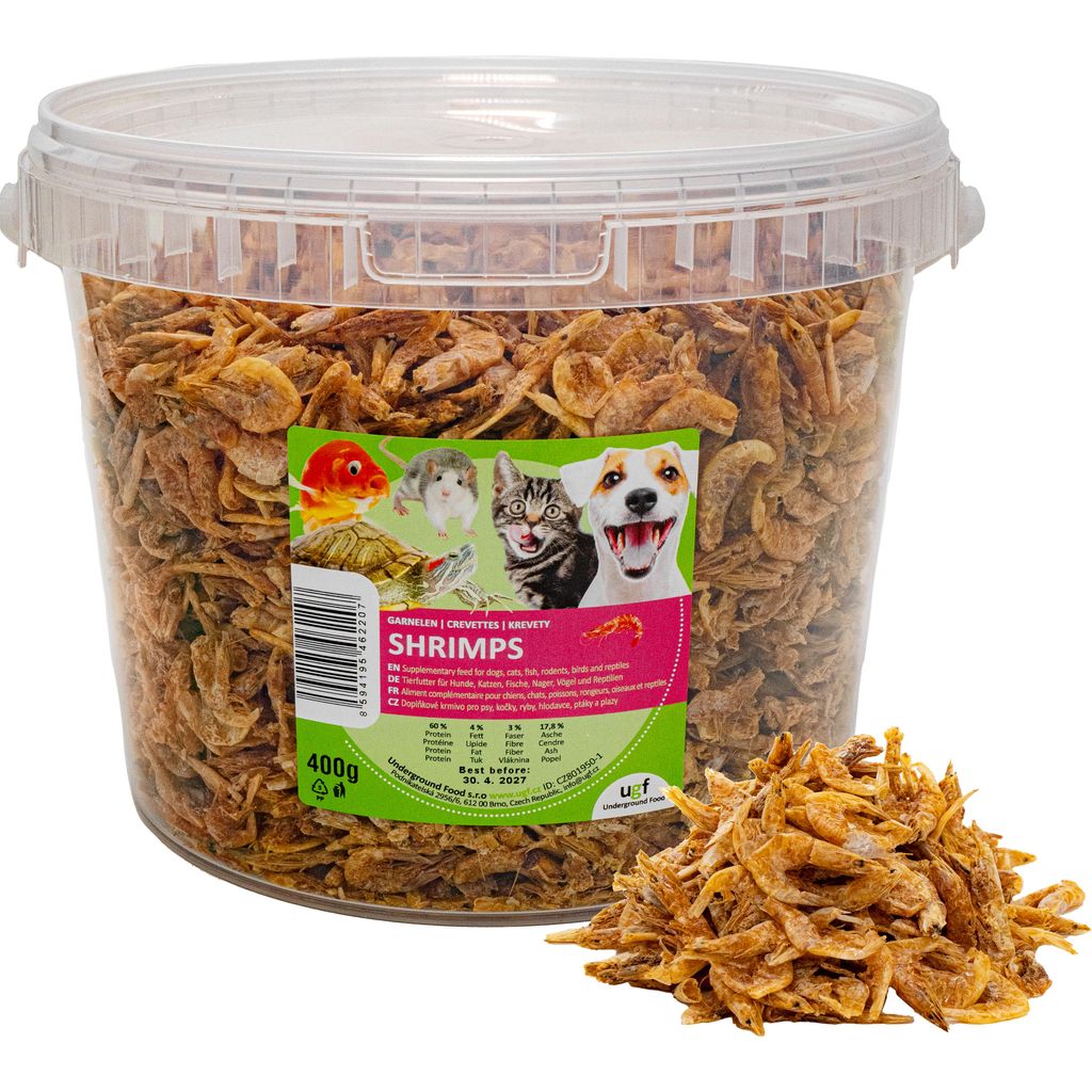 A large plastic tub filled with dried shrimp, with a label showing various pets and product information.