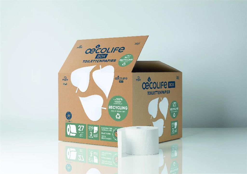 A cardboard box of toilet paper with one roll in front of it.