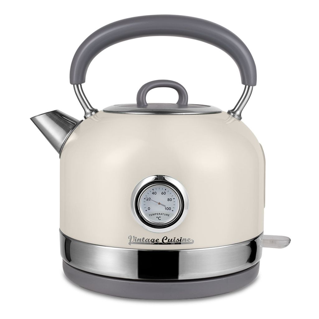 A cream-colored electric kettle with a vintage design, featuring a built-in thermometer and a gray handle, is presented against a white background.