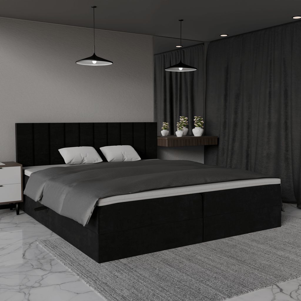 A modern black upholstered bed with white pillows, set in a dimly lit bedroom with dark curtains and pendant lights.