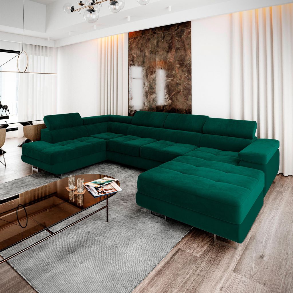 A large green sectional sofa is arranged in a modern living room with a coffee table in front of it.