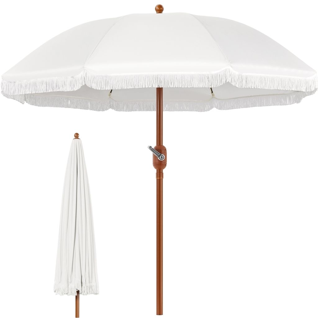 A white umbrella is shown open, with a closed umbrella in the background.