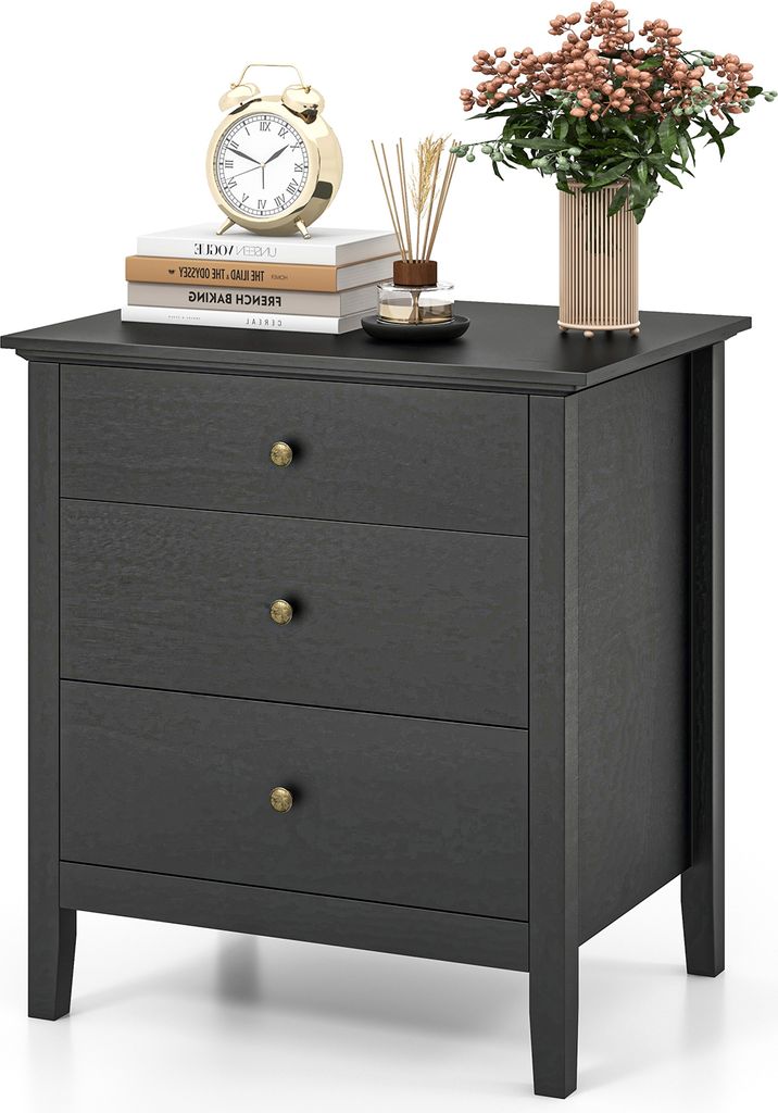 A dark gray three-drawer nightstand with decorative items on top.