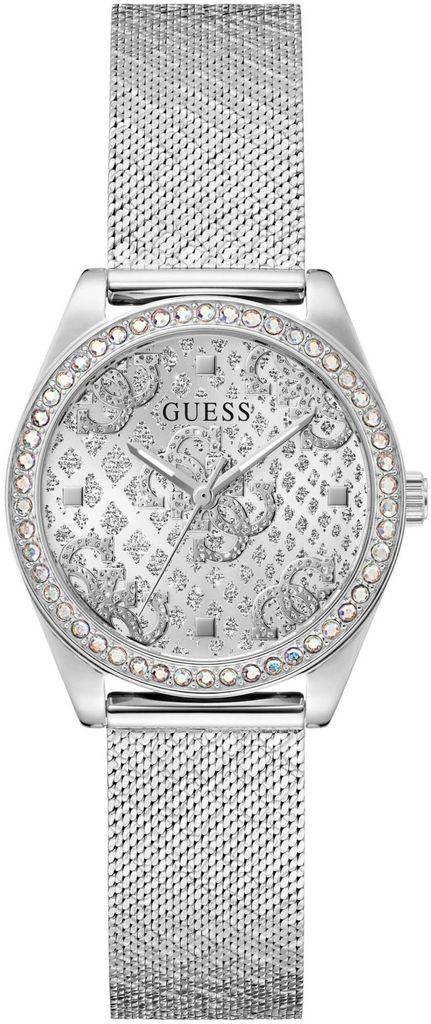 A close-up studio shot of a silver Guess watch with a mesh band and a crystal-embellished face.