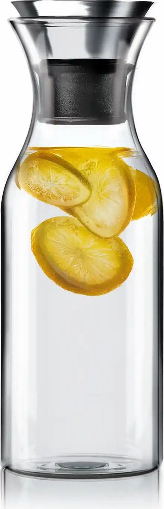 A clear studio shot of a glass carafe filled with water and lemon slices.