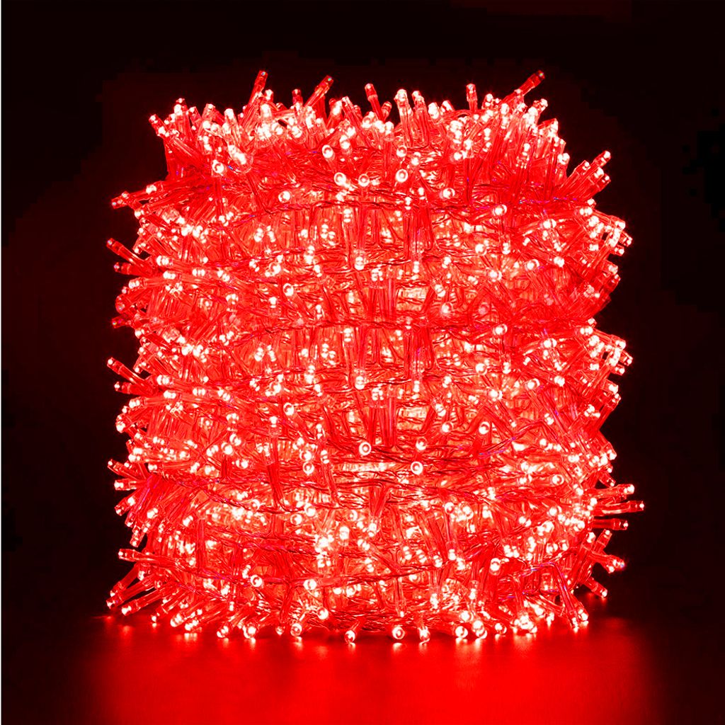 A tightly wound coil of red LED string lights against a black background.