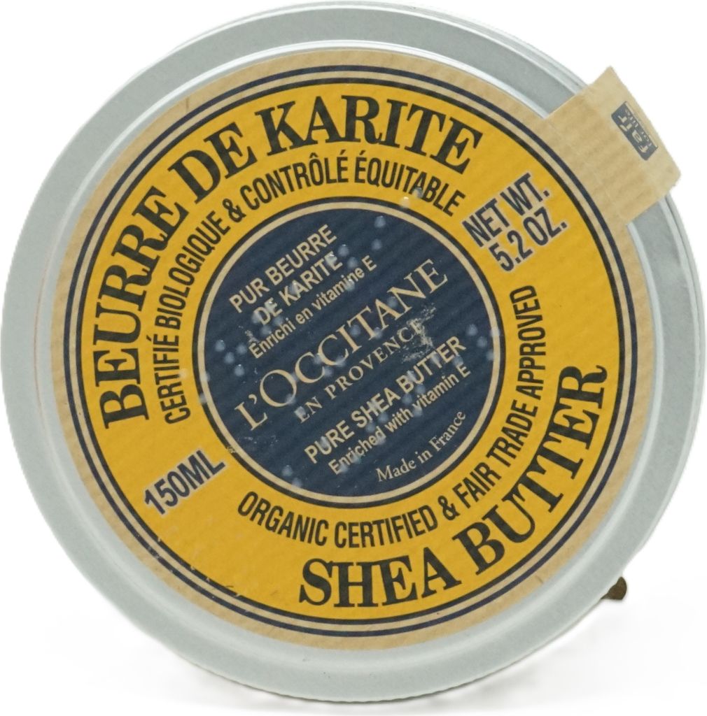 A top-down view of a L'Occitane Shea Butter container.