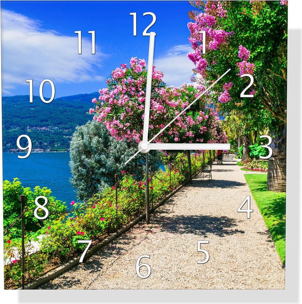 Wallario Design Wanduhr Blütenpromenade am Seeufer aus Echtglas, Größe 30 x 30 cm