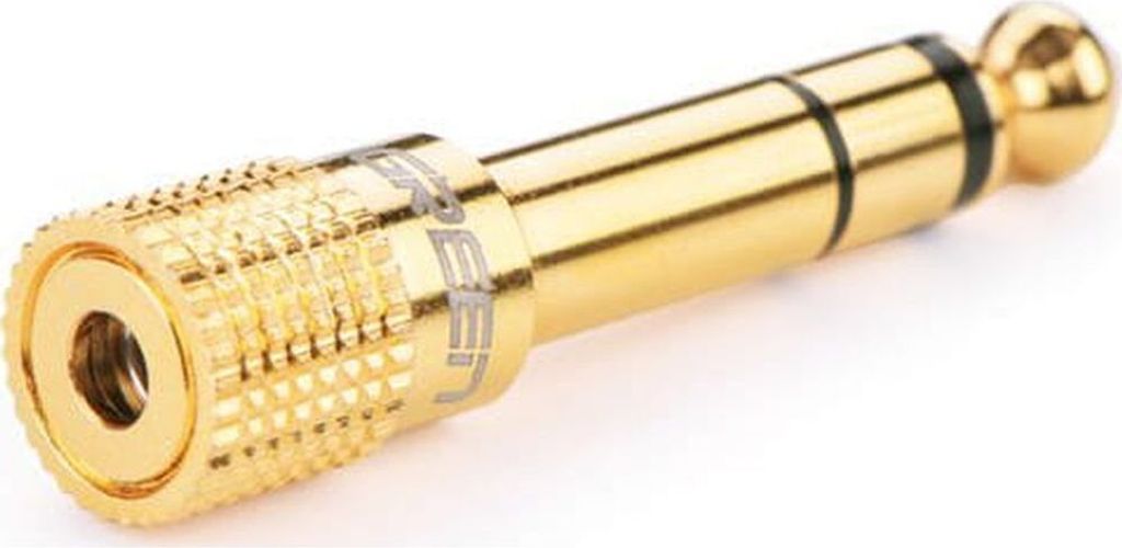 A close-up studio shot of a gold audio adapter.