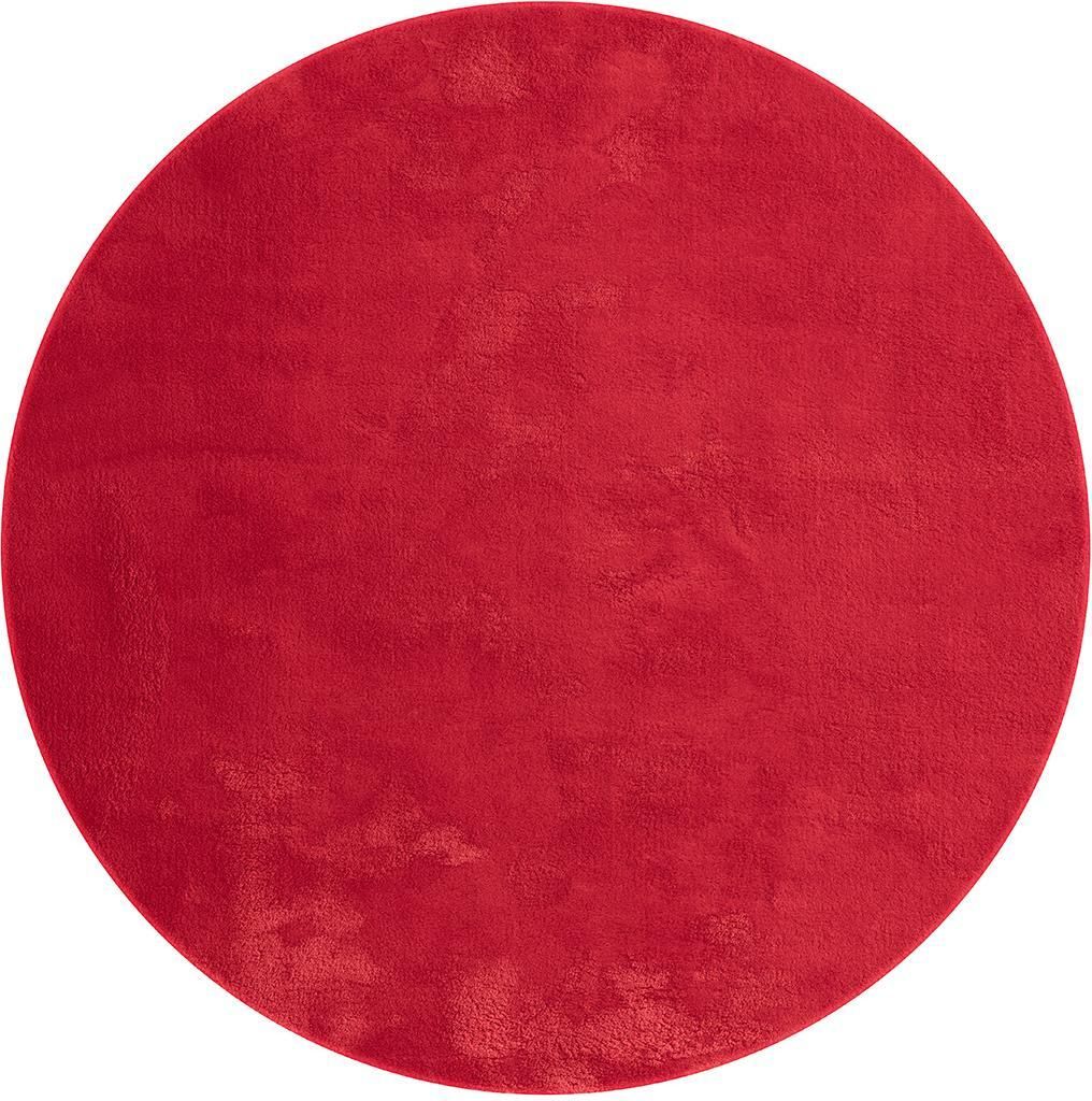 A circular red rug is shown from a top-down perspective against a white background.