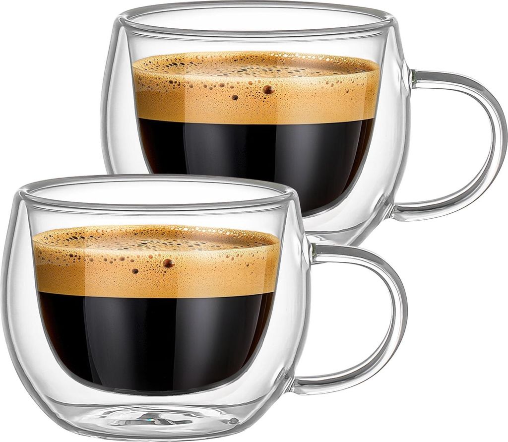 Two clear glass cups filled with espresso coffee and topped with crema, presented against a white background.