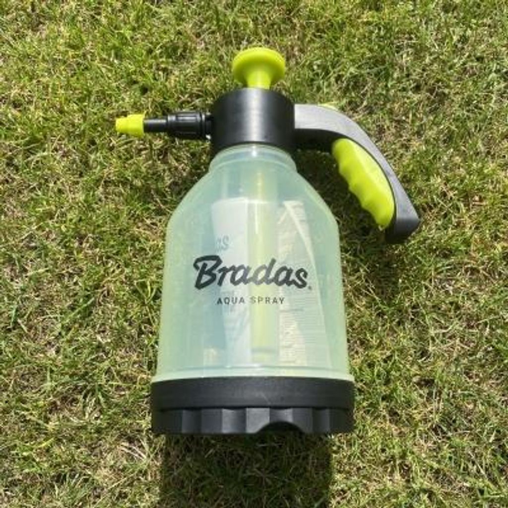 A plant sprayer on grass.