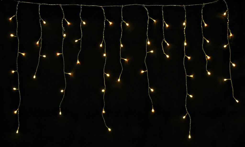 A string of warm white LED lights against a black background.
