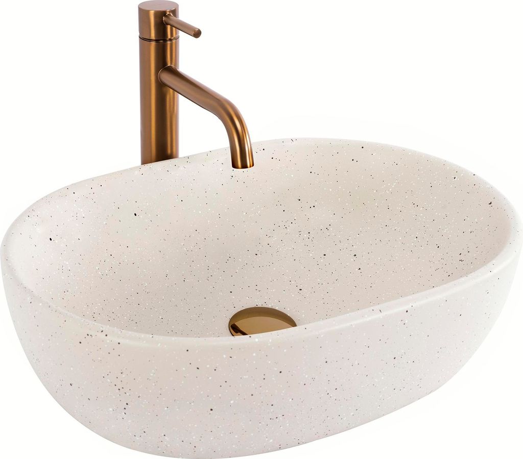 A white speckled basin with a bronze faucet against a white background.