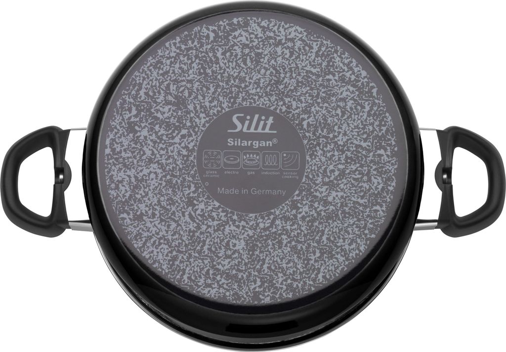 The bottom of a black pot with a speckled gray base and two black handles.
