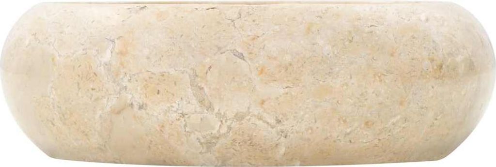 A close-up, side view of a cream-colored marble washbasin against a white background.