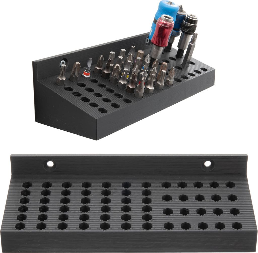 A black bit holder with many hexagonal slots for bits, shown from a diagonal angle.