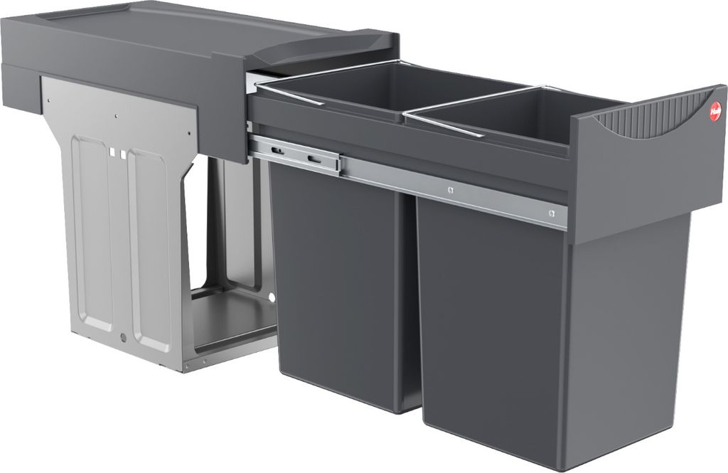 A built-in waste bin system with two compartments, shown pulled out from its cabinet.
