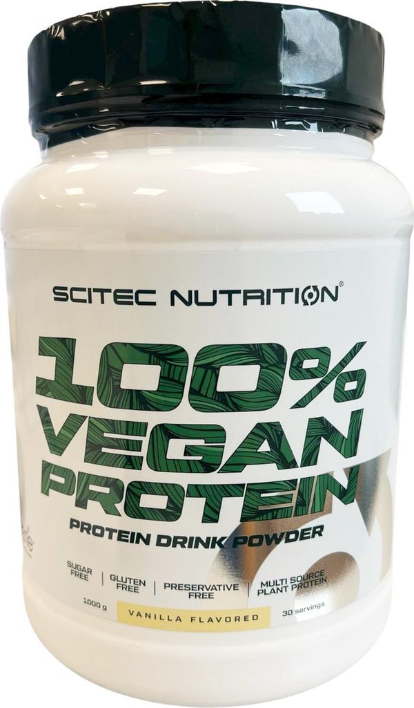 A white plastic container of protein powder with green and white labeling.