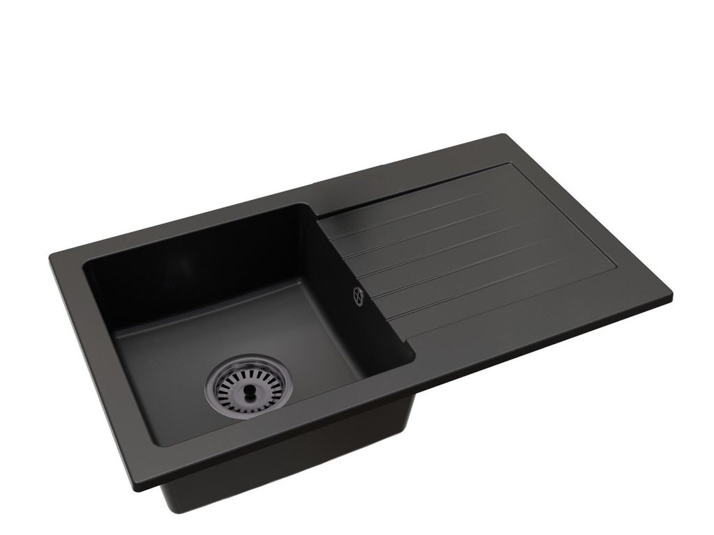 A black kitchen sink with a drainboard, shown from a diagonal angle against a white background.