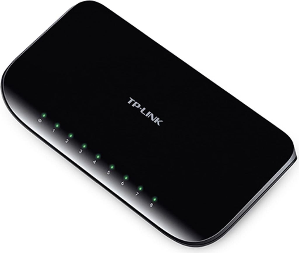 A black TP-Link network switch with multiple green indicator lights.