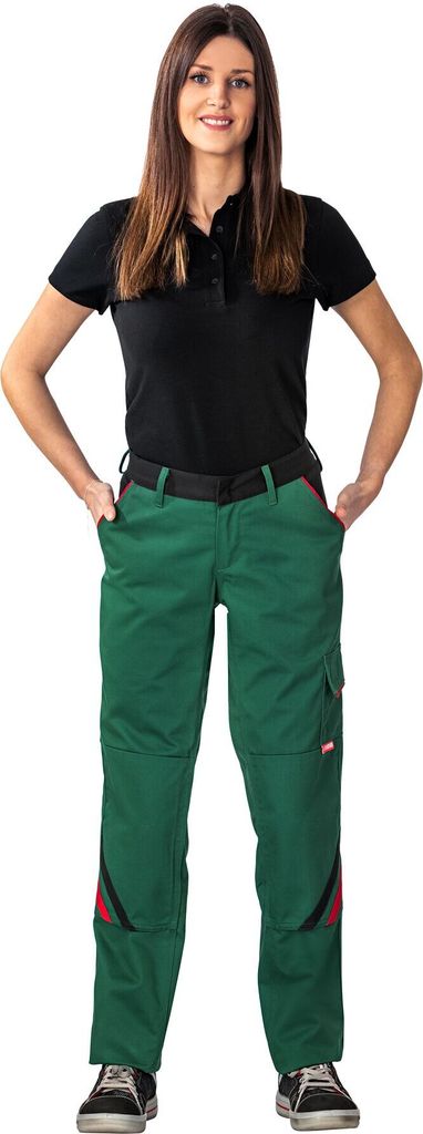 A woman is standing and posing for a product photo, wearing work pants.