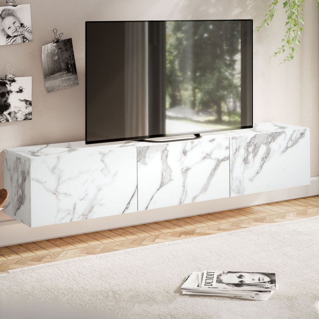 A modern living room with a wall-mounted TV stand.