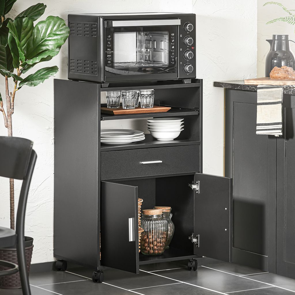 A black kitchen cart with an oven on top, dishes and jars inside, in a kitchen setting.