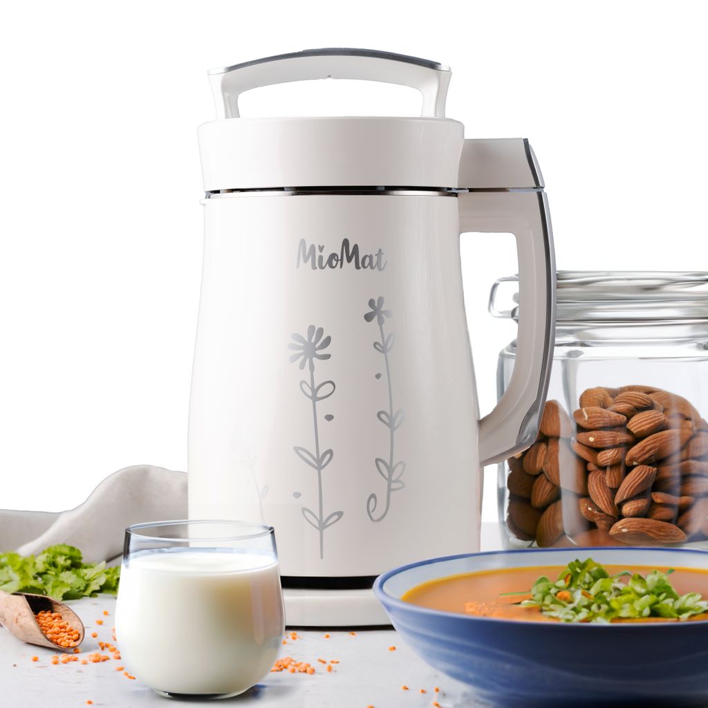 A white soy milk maker is displayed with ingredients and finished products such as milk, almonds, and soup.