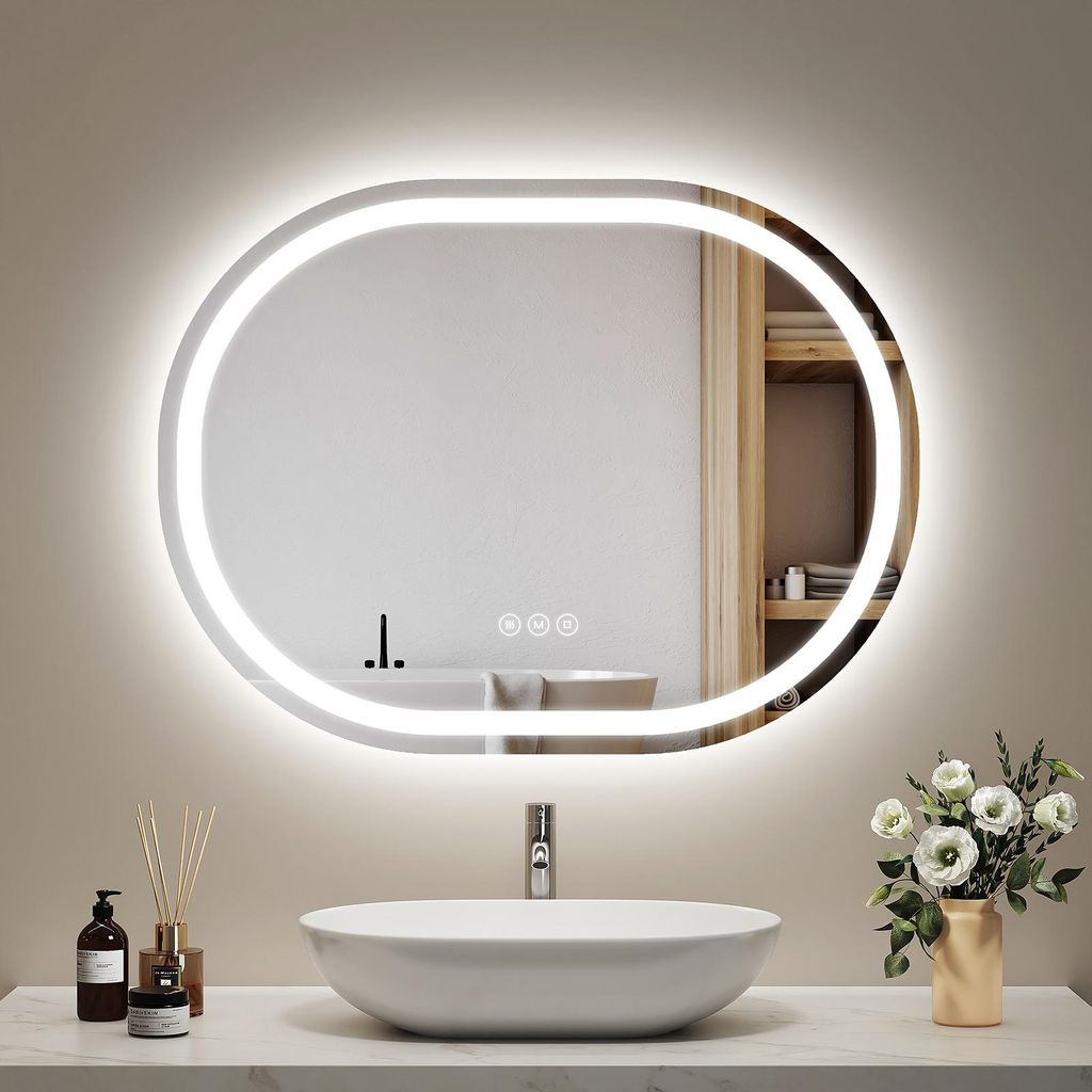 A modern bathroom vanity with a sink, faucet, and an illuminated oval mirror.