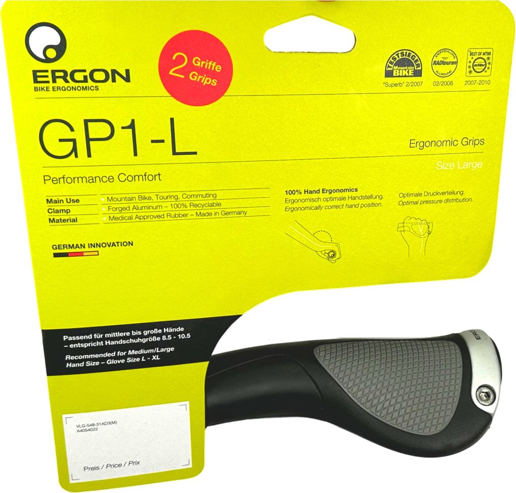 The image shows the packaging for Ergon GP1-L ergonomic bike grips. The packaging is primarily yellow with black text and graphics. A portion of the actual grip is visible at the bottom right.