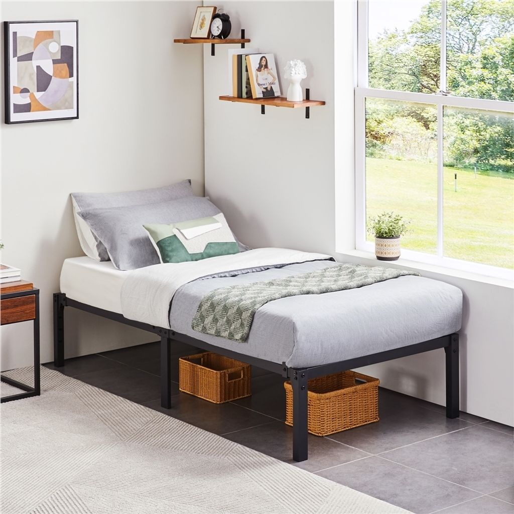 A bedroom corner with a single bed, shelves, and a window.