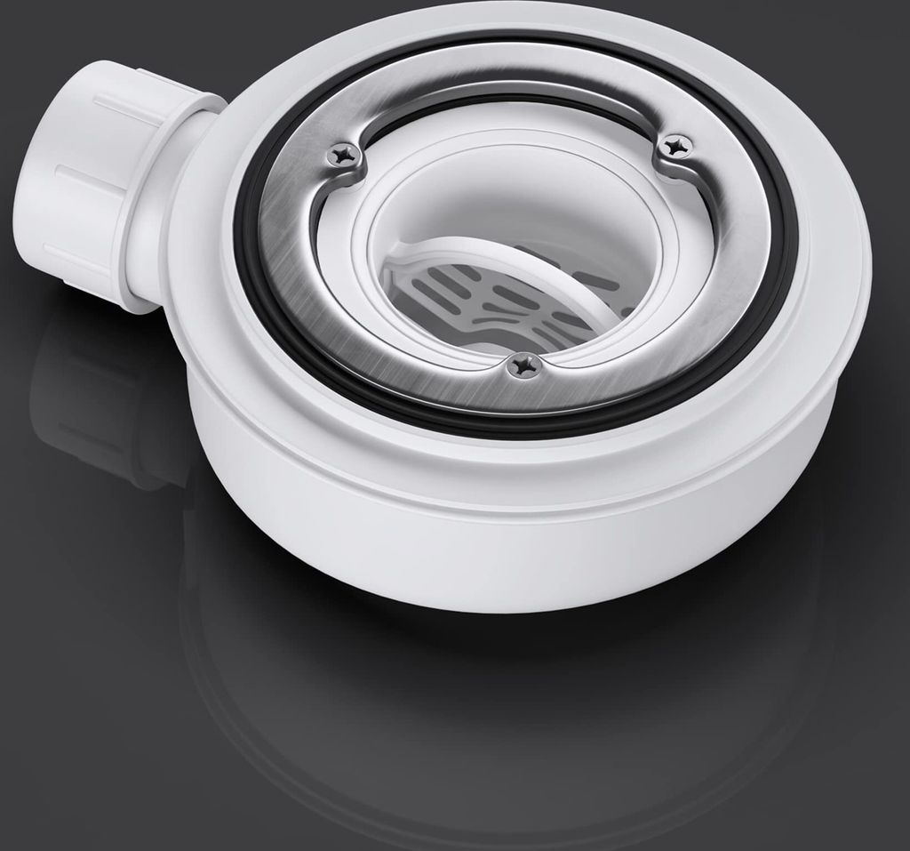 A close-up studio shot of a white shower drain assembly with a silver grate, set against a dark, reflective background.