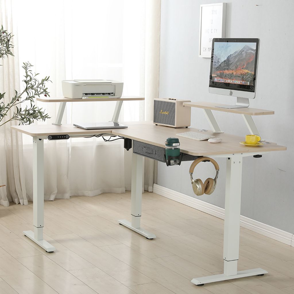 An L-shaped standing desk with office equipment.