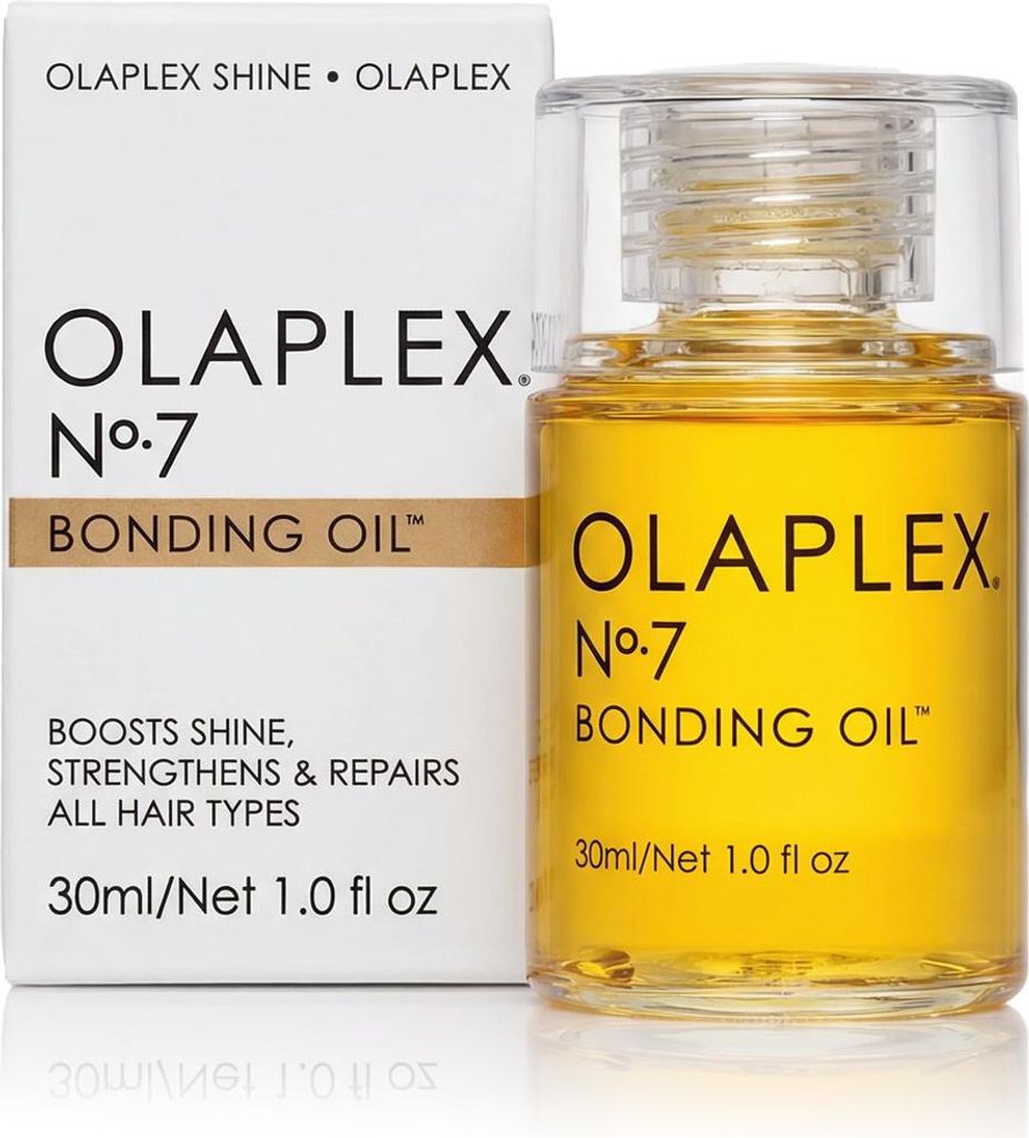A bottle of Olaplex No. 7 Bonding Oil next to its packaging.