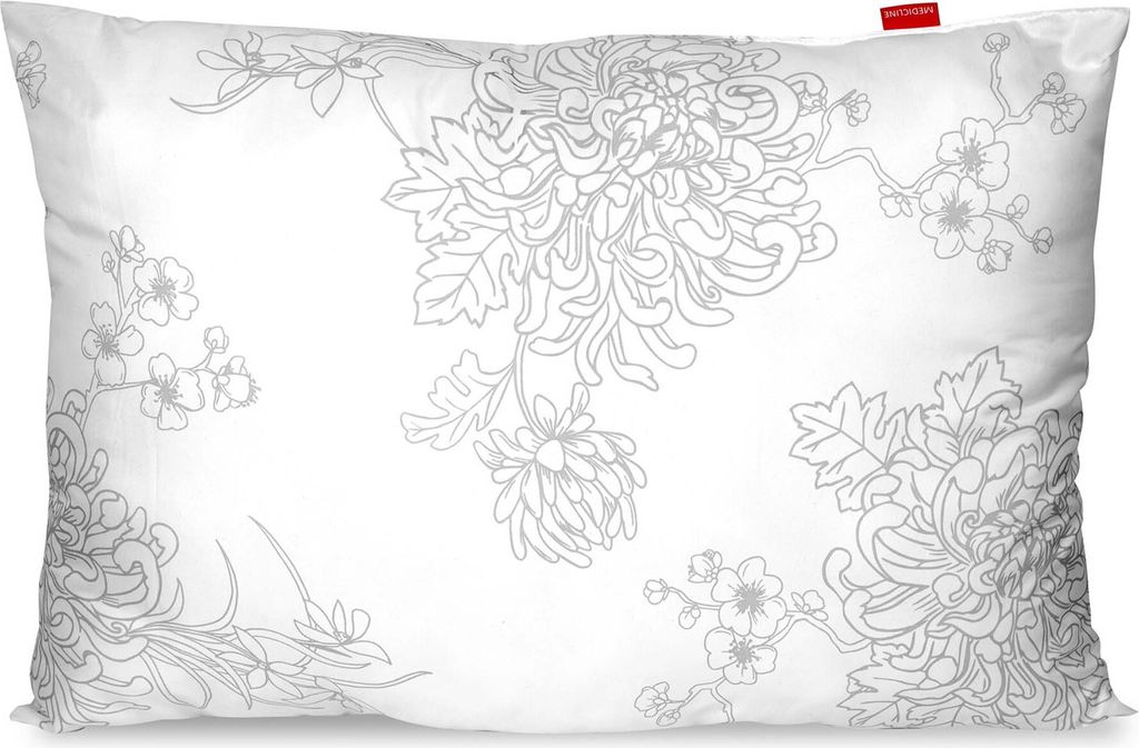 A white pillow with a gray floral pattern.